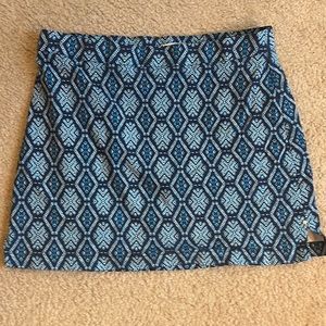 Navy blue skort with light blue designs with tiny splits on each side